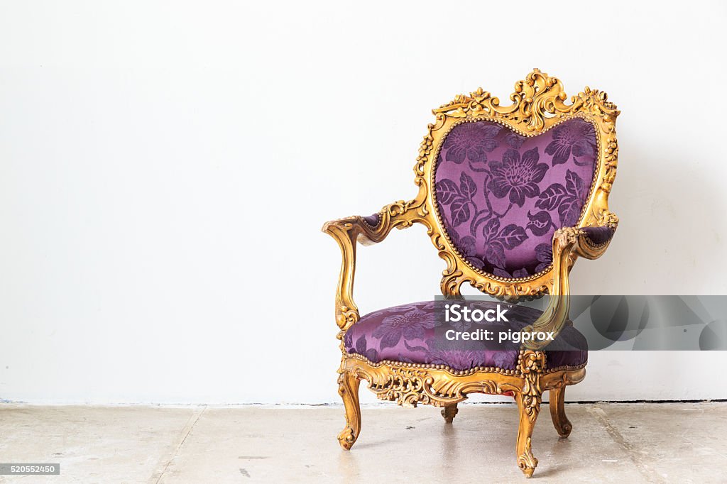 vintage sofa on white wall. Violet vintage armchair on white wall. Domestic Room Stock Photo