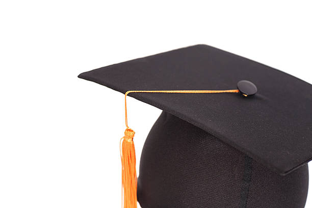 istock Black Graduation Hat with Gold Tassel isolated on white background. 520556042