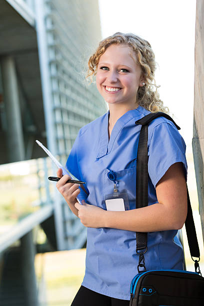 istock Pretty nursing or medical college student smiling after class 520562275