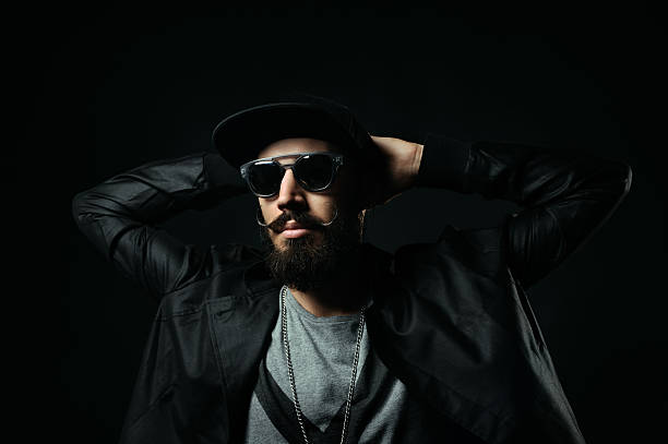 istock The bearded man in sunglasses clasped hands behind his head 520563337