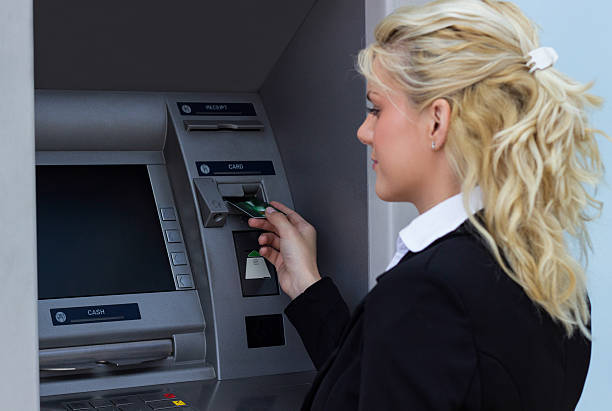 istock Woman taking money out 520563353