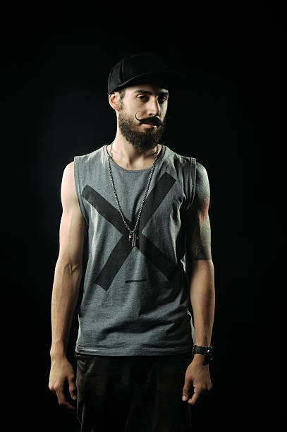 istock The bearded man with tattoos stands up straight 520564803