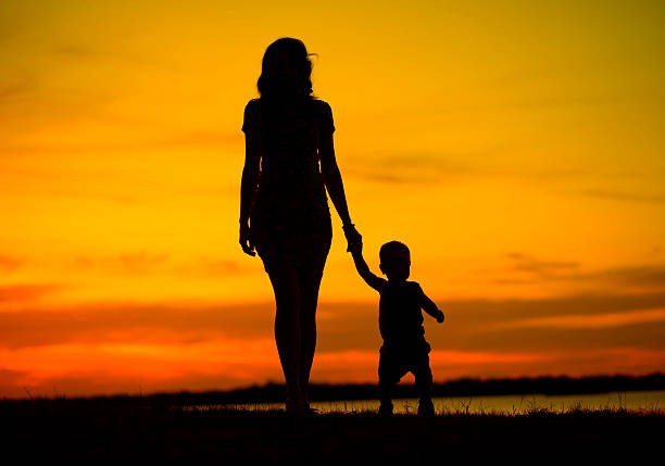 istock Attractive young mother on the walk with child 520566843
