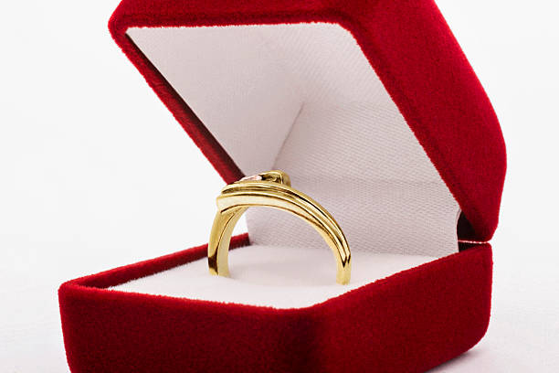 istock Golden ring in red jewelry box 520569969