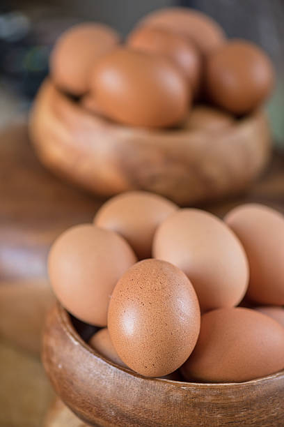 istock Fresh eggs at wooden plate 520580152