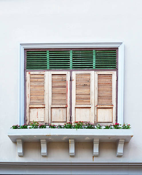 istock Wooden Window And Red Flowers 520580486