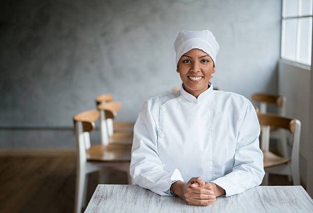 istock Very happy chef sitting at a table 520581606