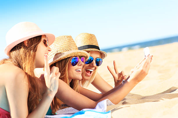 istock Group of friends taking selfie on the beach 520583482