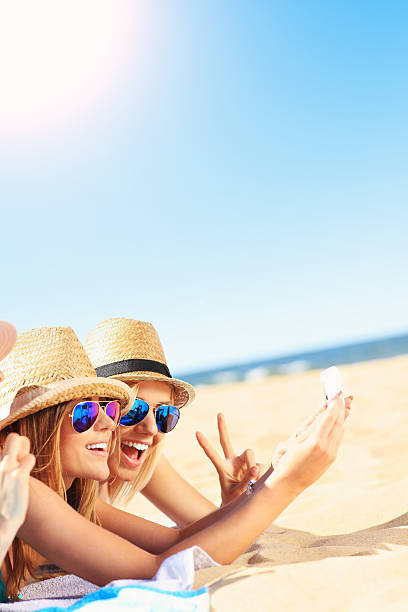 istock Group of friends taking selfie on the beach 520583532