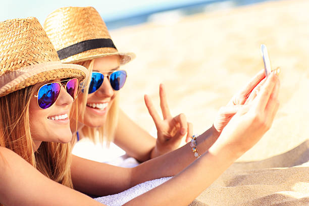 istock Group of friends taking selfie on the beach 520583830