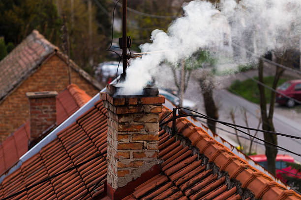 Smoke from a chimney Smoke from a chimney chimney stock pictures, royalty-free photos & images