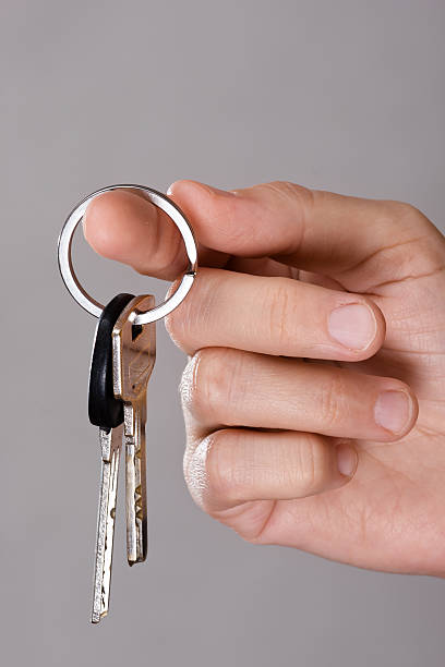 istock closeup of hand holding keys 520586422