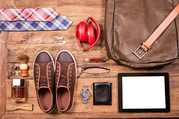 Men's accessories organized on table.  No people.  Knolling.