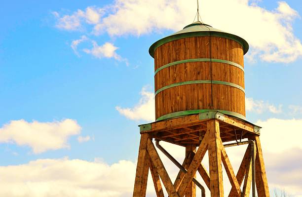istock Wooden water tower standing high in the sky 520589666
