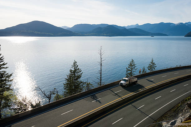 istock Work truck driving along Highway 99, BC, Canada 520590088