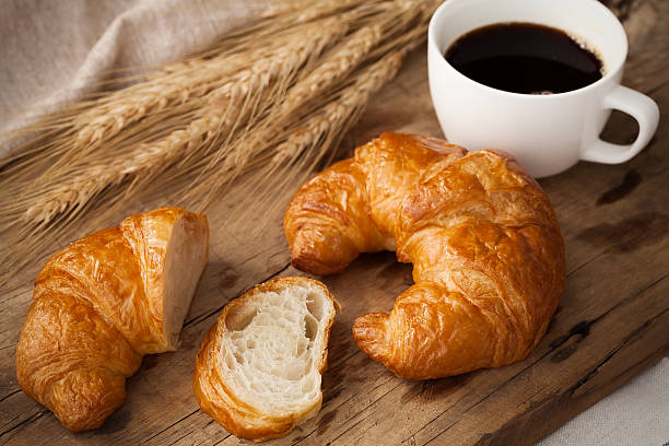 istock Tasty croissant and coffee still life rustic 520590888