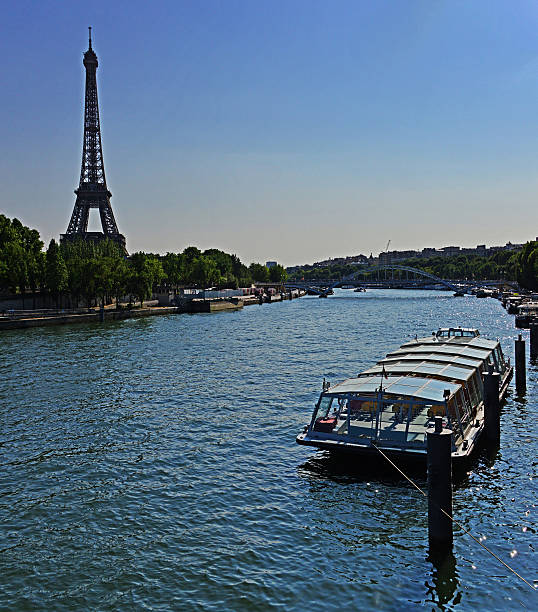 istock Tour boat along the Seine River and the Eiffel Tower 520592648