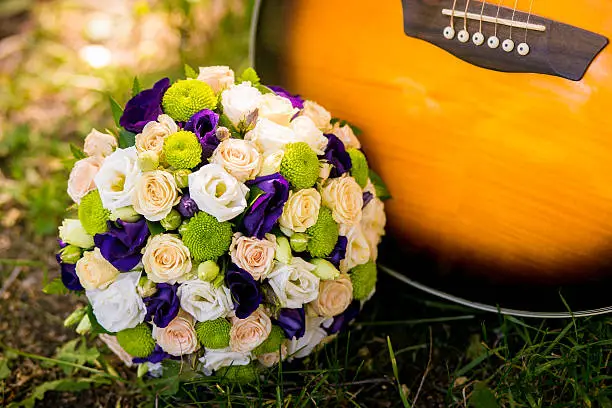 Photo of Wedding bouquet and guitar