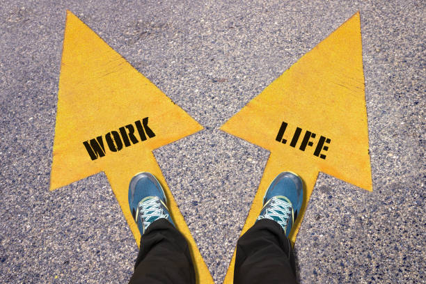 istock Feet and words Work and Life  painted on road 520593782