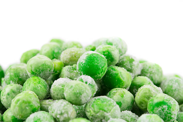 istock Frozen green peas. Close up. 520594068