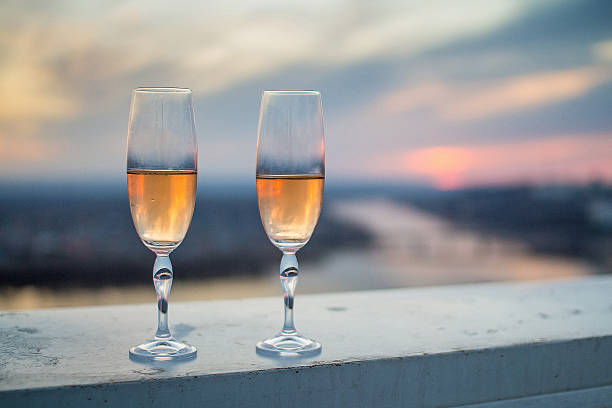 istock Glasses with champers at sunset 520595032