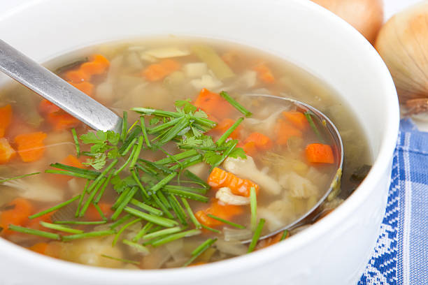 istock vegetarian soup in bowl with fresh herbs and dipper 520598653
