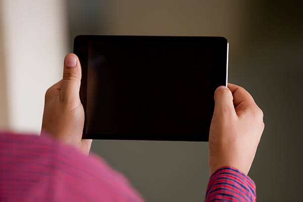 istock Man holding a contemporary digital tablet 520601217