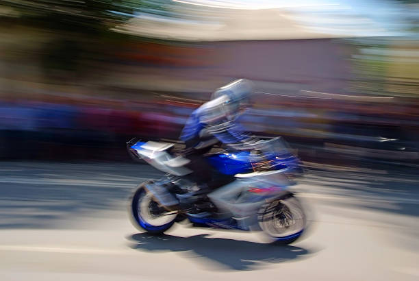 istock biker with a motorcycle in motion blur 520602793