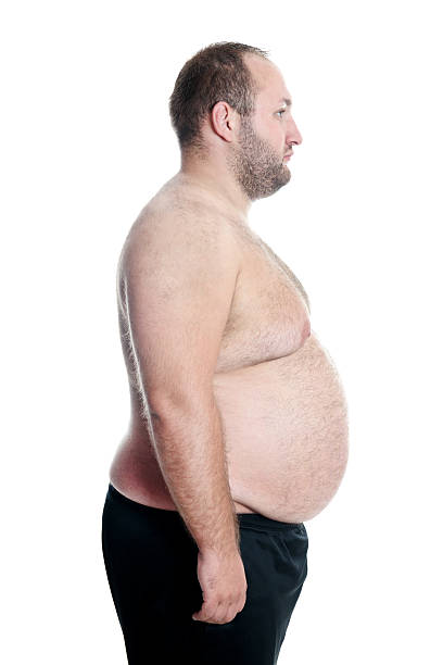 Overweight or Fat Shirtless Man With His Big Belly Overweight or Fat Shirtless Man With His Big Belly. Isolated on White. fat guy no shirt stock pictures, royalty-free photos & images