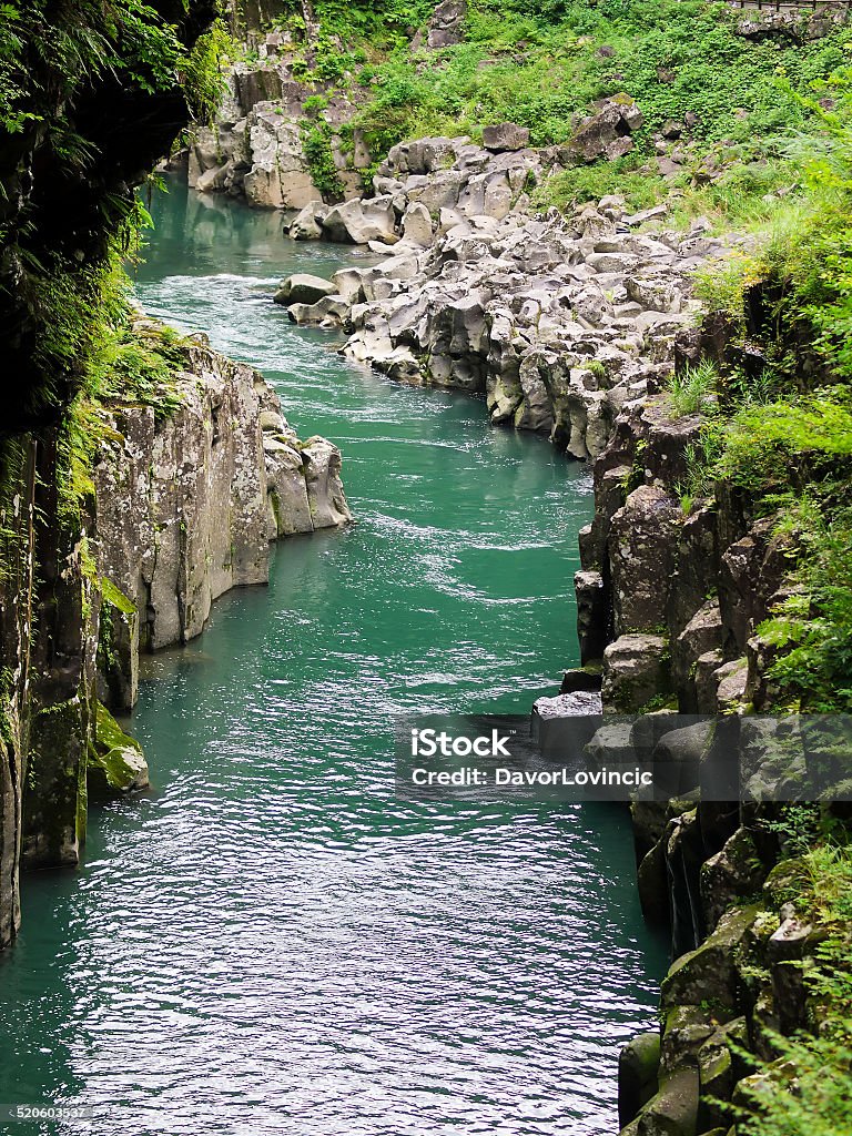 Gokase River Top view of the Takachiho Gorge, which is a narrow gorge made trough volcanic rock by the Gokase River. It has impressive 17 m waterfall, Minainotaki. According to Japan legends, grandchild of Sun Goddess Amaterasu descended in canyon from Heaven. Asia Stock Photo