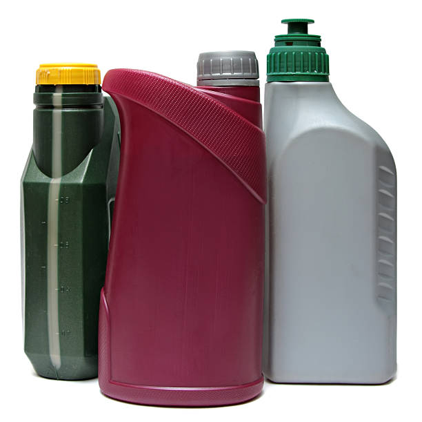 istock Plastic bottles from automobile oils isolated on white background 520605441