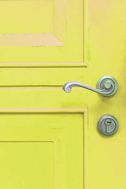 istock classic door handle on yellow door 520605839