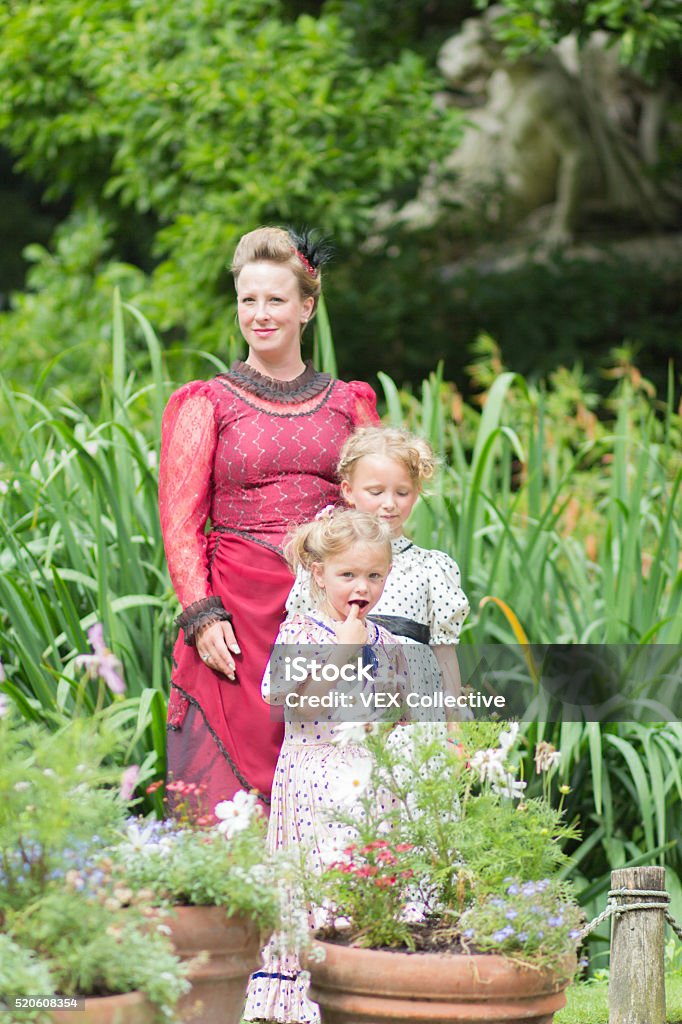 mother and daughters in edwardian dress A family dressed in edwardian outfit 2-3 Years Stock Photo