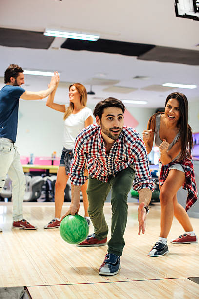 istock Young Man bowling with his friends. 520609058