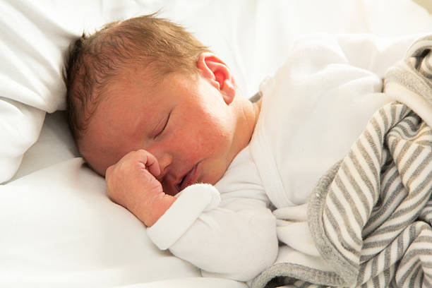 istock Sleeping 1 day old baby boy 520610210
