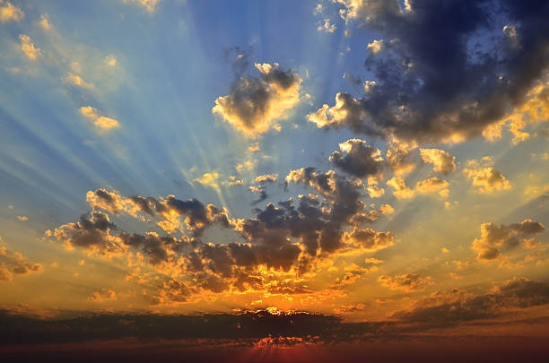 istock Cloudy sky in the background of the rising sun 520610392