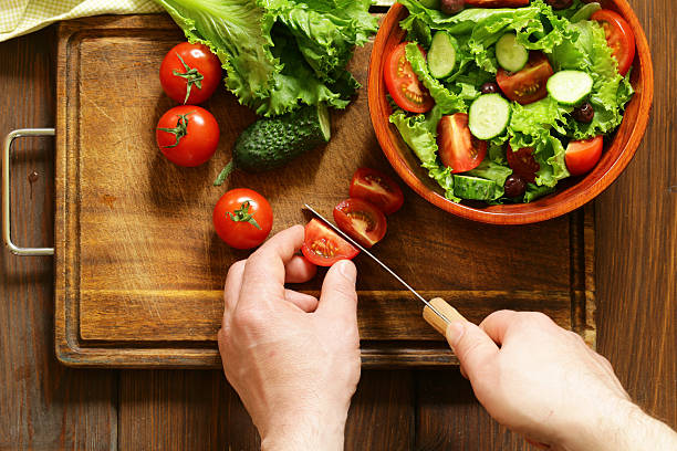 istock cooking vegetable salad on a wooden board, top view 520611780