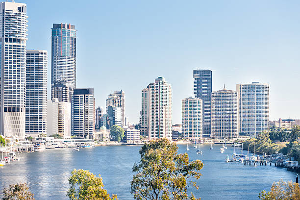 istock Modern city with tall buildings in front of a river 520613006