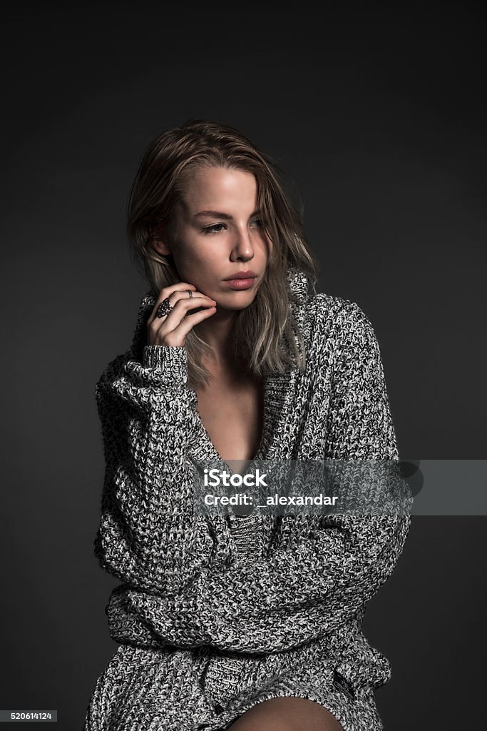 Beautiful blonde posing in sweater Beautiful blonde posing in sweater. Studio photoshooting. 30-39 Years Stock Photo