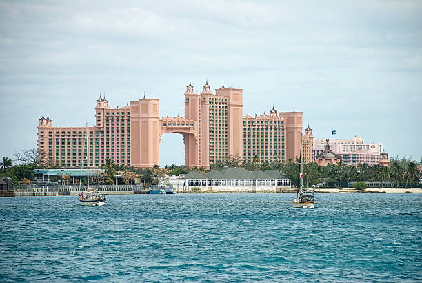 Atlantis Resort, Paradise Island Nassau, The Bahamas - March 22, 2016: View of the main towers of the Atlantis Resort on Paradise Island viewed from the port of Nassau. atlantis bahamas stock pictures, royalty-free photos & images