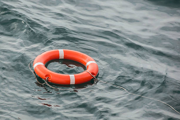 istock lifebuoy thrown to assist floats on water 520616828