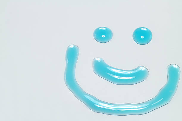 smile face of clear blue water on gray background