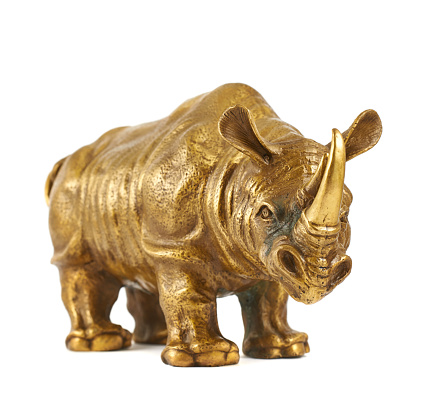 Rhinoceros rhino sculpture made of cast metal isolated over white background