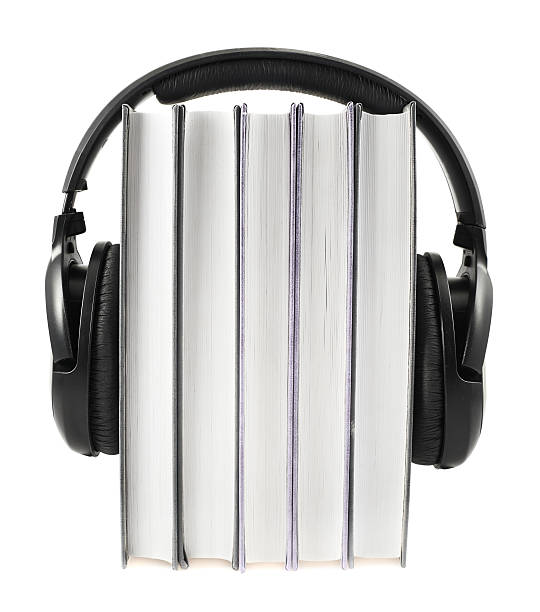 istock Books with a headphones on isolated 520619422