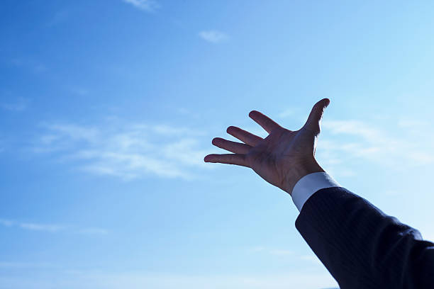 istock The blue sky and the businessman 520620776