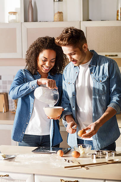 istock Positive couple cooking together 520620824