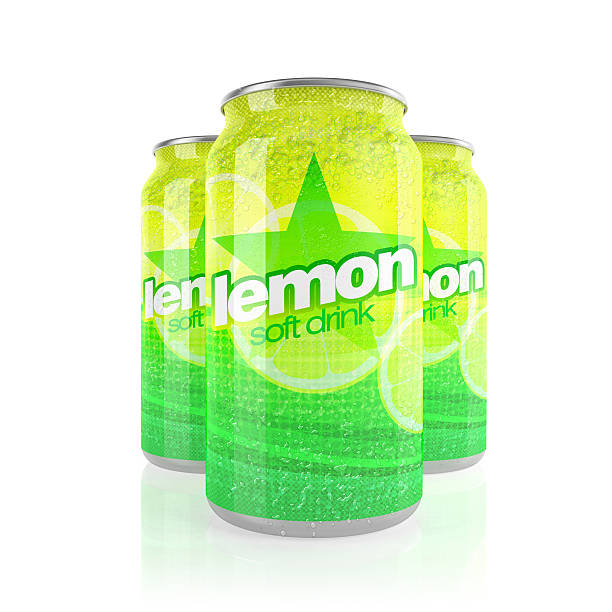 istock Lemon soft drink in three yellow cans, white background 520621185