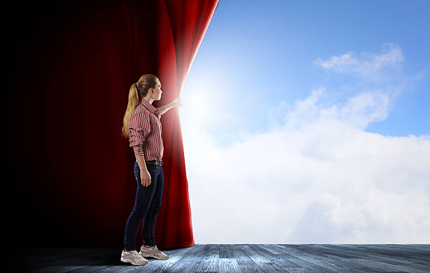 istock Girl opening curtain 520621223
