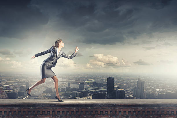 istock Running businesswoman 520621327