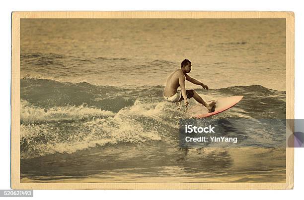 Surfer Surfing In Kauai Hawaii Old Antique Postcard Stock Photo - Download Image Now